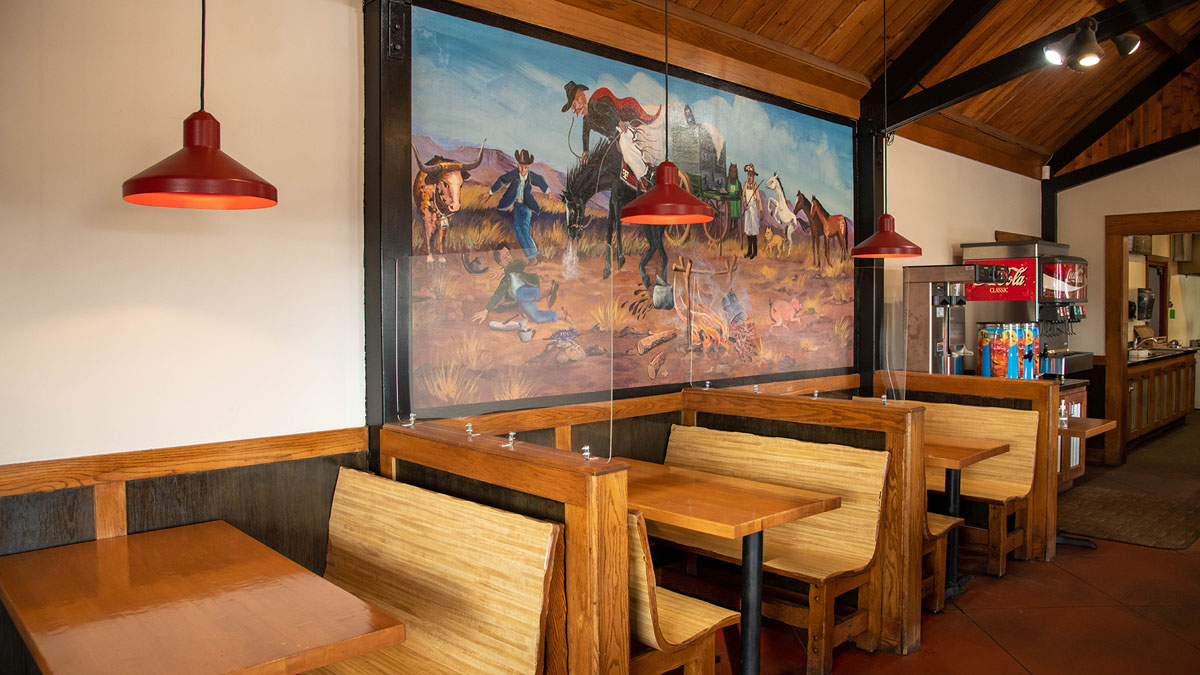 Interior image of Bigham's Smokehouse showcasing the dining area tables